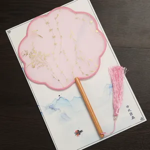 Traditional Chinese pink round fan with gold foil pattern wooden handle and tassel