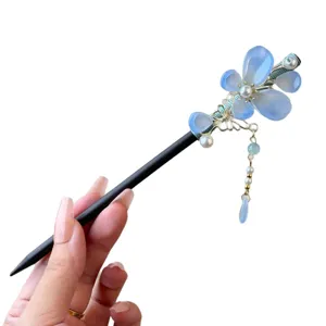 Chinese vintage wooden hairpin with blue flower pearl and tassel for elegant women hair styling.