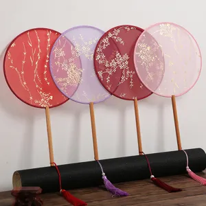 Éventail rond chinois traditionnel avec long manche en bois et gland pour danse Hanfu.