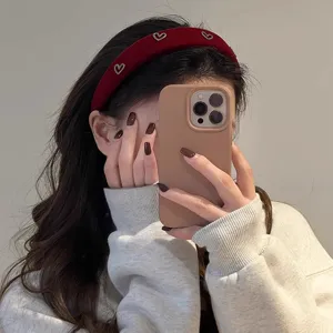 Retro red velvet wide headband for women, stylish heart-embellished hair hoop for daily wear.