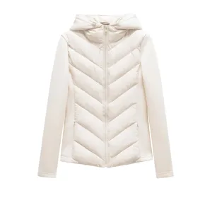 Close-up view of the beige hooded puffer jacket detail featuring chevron stitch and zipper.