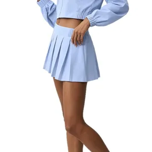 Light blue women crop sports jacket and pleated tennis skirt set, activewear outfit main view.