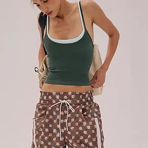 Detail view of the contrast color sports tank top, showing the breathable fabric and back design.