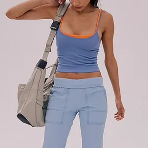 Detailed view of the women's stylish layered contrast color sports tank top for yoga and fitness.