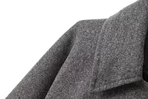 Detail tissu veste blazer en laine grise, gros plan manteau classique a manches longues col.