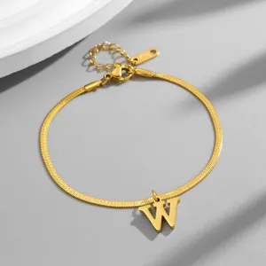 Gold herringbone chain bracelet with letter W pendant, stylish initial jewelry piece.