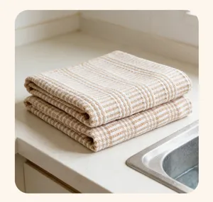 Detailed view of thick woven kitchen tea towel with classic stripes on counter.