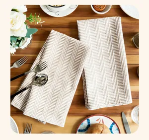 Close-up detail view of cotton striped kitchen tea towel table setting, soft texture.