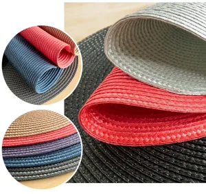 Close up detail view of round woven PP placemats showing texture and color options.