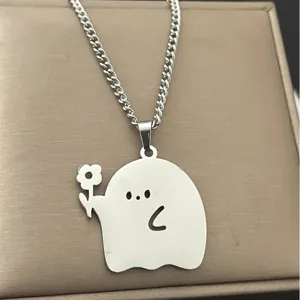 Detailed view of cute little ghost holding flower necklace pendant, silver chain, lovely gift.