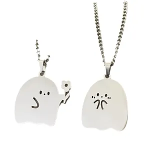 Cute little ghost metal pendant detail view, silver couple necklace close up showcase.