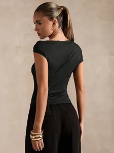 Detail shot of a sleek black asymmetric single sleeve top, showcasing stylish apparel fit.