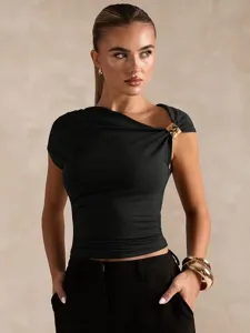 Detail view of black asymmetric off-shoulder top with gold buckle, ruched slim crop shirt