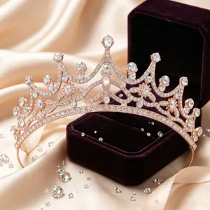 Close-up rose gold bridal tiara with sparkling crystal rhinestones and purple velvet box detail