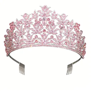 Detailed closeup of sparkling pink crystal tiara with side combs, elegant wedding hair accessory.