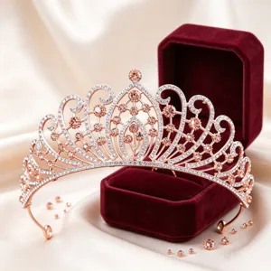 Detailed view of a gorgeous rose gold rhinestone tiara crown for wedding bridal hair styling accessories.