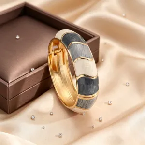 Vintage enamel geometric open cuff bracelet, stylish gold-plated alloy jewelry for women.