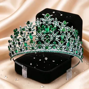 Detail view of exquisite silver bridal tiara with sparkling green rhinestones and hair combs.