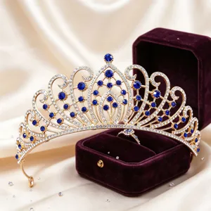 Exquisite gold bridal tiara with sparkling rhinestones and blue crystals, detail display.