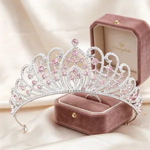 Exquisite crystal tiara detail shot, shimmering rhinestones and pink stones for bridal styling.