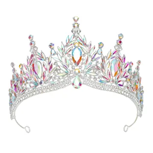 Close-up detail of silver crystal tiara featuring iridescent AB rhinestones and sparkling stones.