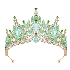 Detailed close-up of green crystal tiara, showcasing intricate leaf alloy design and sparkling stones.