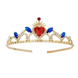 Detail view of a gold rhinestone tiara with a red heart and blue gemstones for kids.