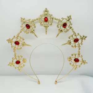 Gothic baroque halo crown headband detail, gold metal sunburst headpiece with red gems.