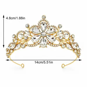 Close-up of a luxurious gold rhinestone bridal tiara, showcasing intricate crystal details.