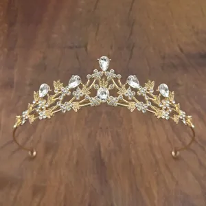 Gold crystal princess crown detail view, sparkly rhinestone tiara for girls party event.