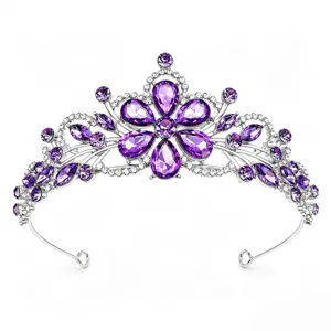 Detailed view of the sparkling purple rhinestone bridal tiara, silver metal wedding hair accessory crown.