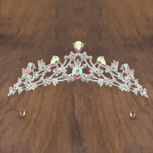 Detailed view of silver crystal princess tiara with iridescent rhinestones for kids stage.