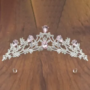 Detailed view of silver children's princess crystal tiara with sparkling pink rhinestones.