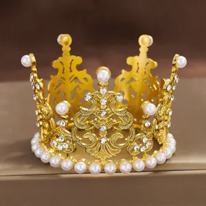 Exquisite mini gold crown cake topper with pearls and rhinestones for floral bouquet decor.