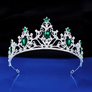 Silver wedding tiara with green rhinestones, elegant princess hair crown for parties.