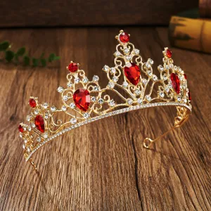Gold bridal crown detail showing sparkling red teardrop gems and clear crystal rhinestones.