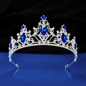 Exquisite silver rhinestone bridal tiara detail, sparkling blue crystal crown display.
