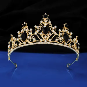 Gold black rhinestone tiara crown detail shot, elegant bridal princess hair accessory for party.