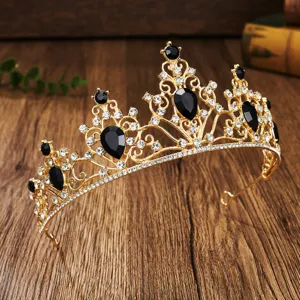 Detailed close-up shot of a luxury gold tiara featuring black and clear sparkling rhinestones.