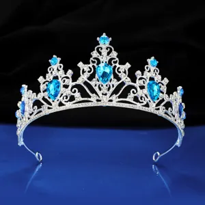Silver tiara detail featuring blue crystal rhinestones, exquisite wedding crown accessory.