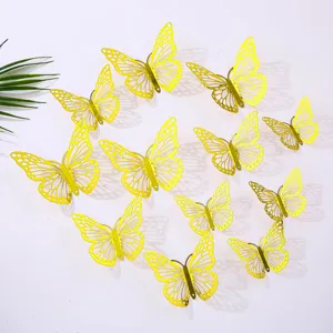 Ensemble d'autocollants muraux papillon 3D creux jaunes pour décoration de maison.