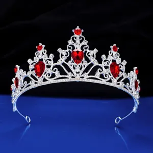 Close-up detail showcasing the sparkling silver tiara adorned with vibrant red rhinestones.