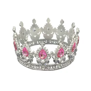 Detailed view of a silver baroque tiara featuring sparkling pink and clear rhinestones.