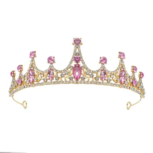 Details of the stunning gold princess tiara featuring sparkling pink and clear rhinestones.