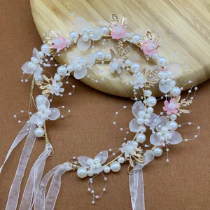 Close-up of kids fairy floral hair wreath with pearls and translucent petals for party.