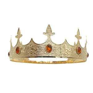 Golden crown detail shot featuring intricate embossed patterns and embedded amber-colored gems.