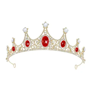 Exquisite golden crystal tiara detail showcasing sparkling red and clear rhinestones.