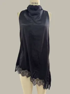 Detailed view of the black satin halter top featuring an asymmetrical lace hem trim.
