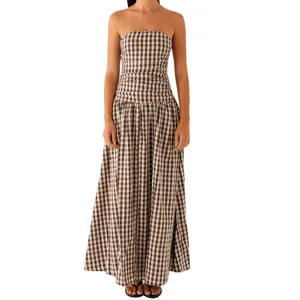 Elegant brown and white gingham strapless maxi dress featuring a shirred bodice detail