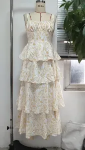 Full length view of a summer floral tiered maxi dress with thin straps on a dress form